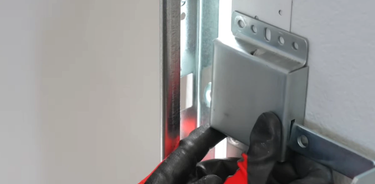 Garage door repair Lexington MN: technician installing a garage door lock
