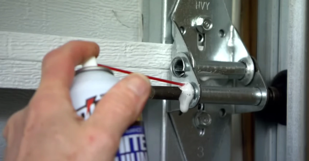 Garage door repair Shoreview MN: lubricating garage door hinges, rollers and springs as routine maintenance