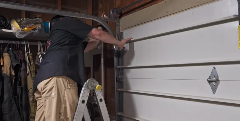 Technician repairing a garage door